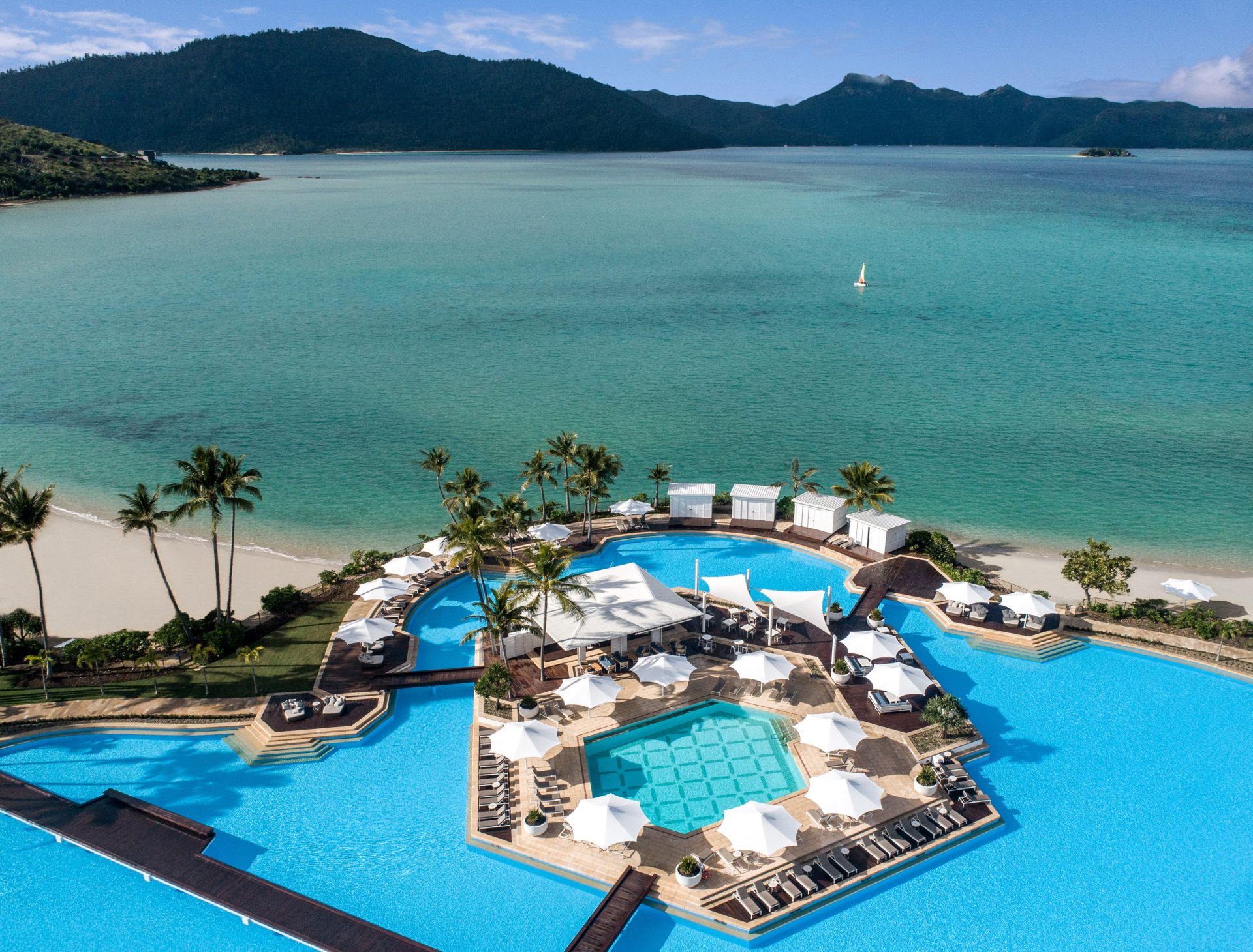 Calm turquoise Whitsunday waters during dry season with clear blue sky