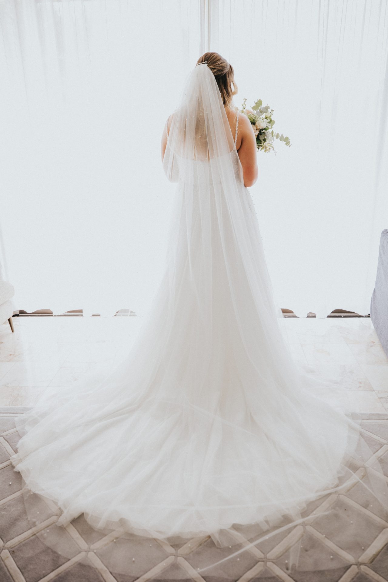 Bride getting ready in Hayman Island suite before elopement ceremony